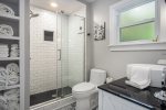 Full bathroom with custom tile walk in shower